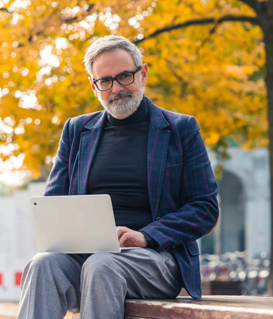 Older man researching Hebrew names on laptop